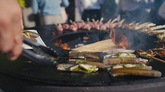 Clams Cooking on Outdoor Fire Pit Grill