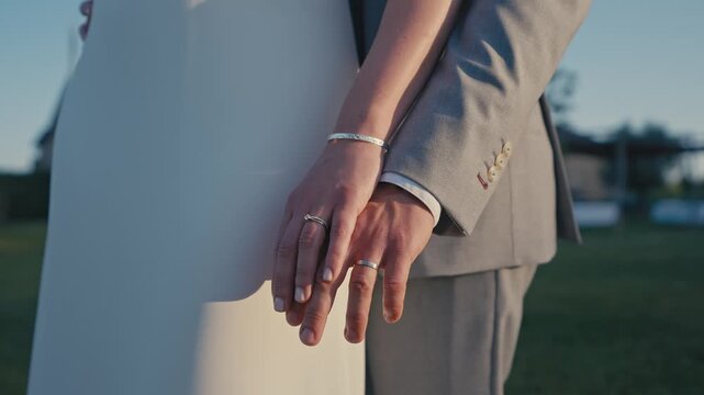 Close Up of Bride and Groom Hands with Wedding Rings