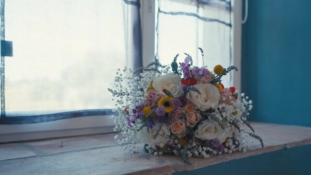 Elegant Bridal Bouquet Resting on Windowsill in Soft Natural Light