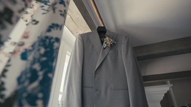 Gray Wedding Suit with Boutonniere and Floral Shirt Before Ceremony