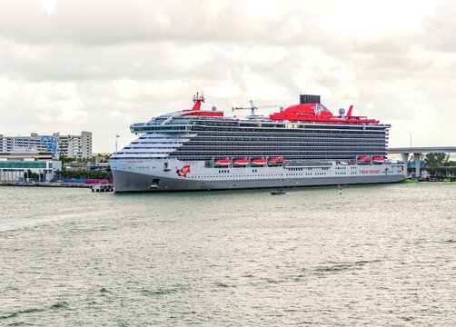 Miami, Florida, USA - November 03, 2024: Valiant Lady cruise ship voyage. Cruise in summer vacation. Virgin Voyages cruise line. Cruise ship tour. Travel at sea. Ship leaving Miami beach port