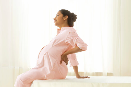 Pregnant woman waiting for the doctor for her monthly checkup. 
