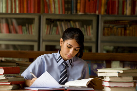 Girl studying in a school library
