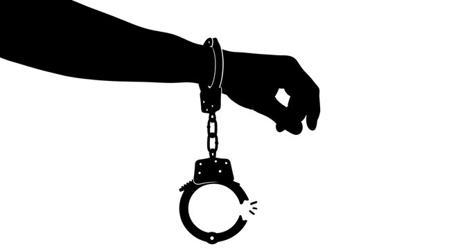 Silhouette of a hand with a broken handcuff for freedom concept