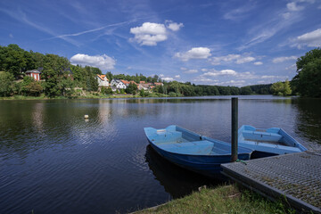 Obraz premium Peaceful Harbor With Picturesque Vistas, Silent Waterfront Showing Faraway Castle And Village