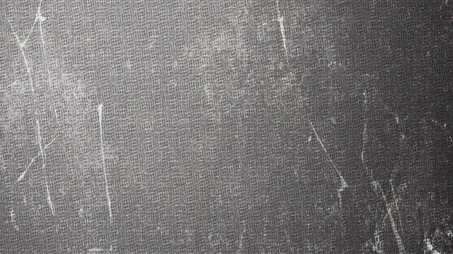 Abstract dark gray scratched textured surface motion background.