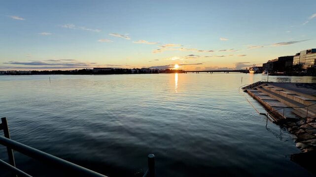 Calm Sea and Pier at Sunset in Jatkasaari Helsinki
