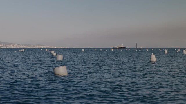 A boat harvesting mussels from a farm in the Gulf of Naples along the Mediterranean coast.