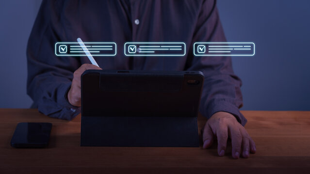 Professional business man working on digital tablet using modern technology for online task management. Concept of virtual checklist for business success and smart workflow.