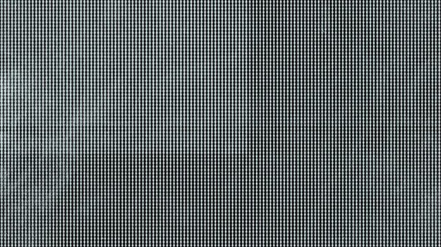 Abstract digital glitch effect with pixelated monochromatic noise pattern on a dark screen background.