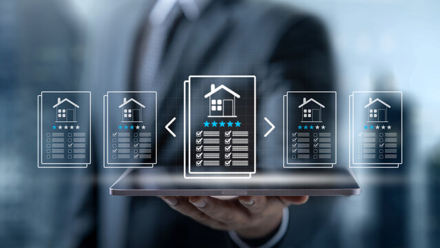Businessman holding a digital tablet to search and compare real estate properties, choosing the best house with high ratings and checklist options. Concept of Appraiser