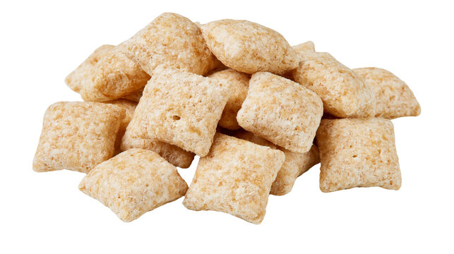 Pile of square puffed cereal pieces with textured surface