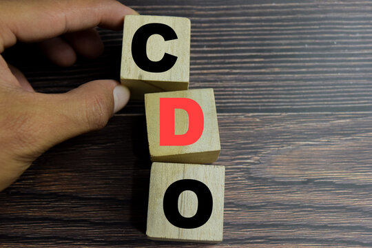 Concept of CDO - Collateralized Debt Obligation text on wooden blocks.