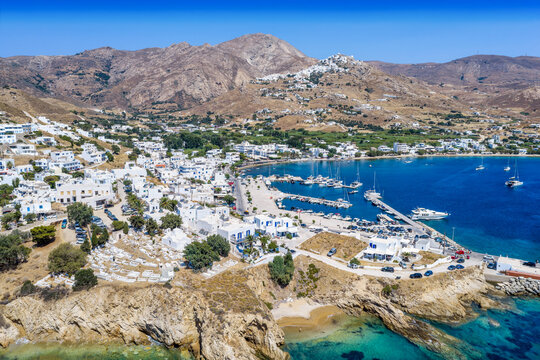 Aerial view of the beautiful town and port of Livadi, Serifos Island, Cyclades, Greece, with whitewashed houses and blue sea