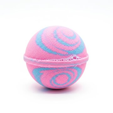 Colorful pink and blue bath bomb with swirling pattern isolated on white background