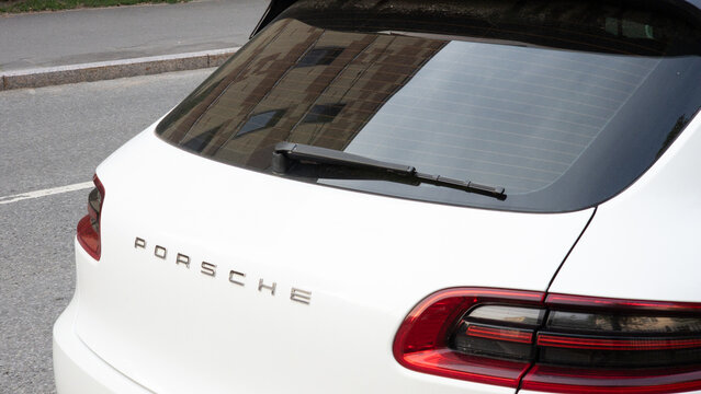 Porsche Macan luxury SUV photographed outdoors, showing rear design, Porsche emblem, modern styling and premium German automotive technology