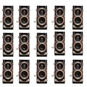 A seamless, repeating pattern featuring vintage twin-lens cameras on a black back-ground.