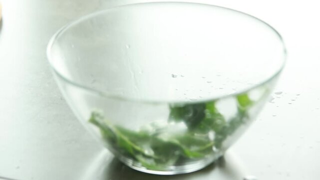 Raw Washed Organic Baby Spinach Leaves Prepared in Glass Bowl