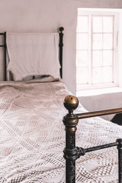 Edwardian Cottage Bedstead In A Bedroom At Morwellham Quay, Devon