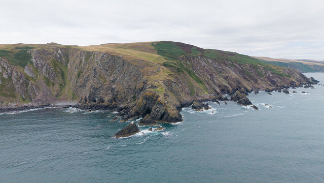 Drone photography shot of dramatic coastal cliffs and Fast Castle headland in Berwickshire, Scotland