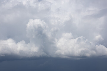 Fototapeta premium Towering storm clouds before rainfall with dramatic overcast sky