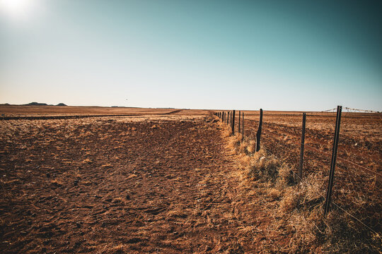 Australia, The Dingo Fence, built in the 1880s, is the longest fence in the world. It stretches 5,614 kilometers across Australia to protect sheep flocks from dingo attacks.