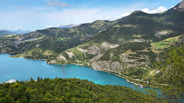 Lake Lac de Serre-Poncon surrounded by mountains in French Alps, Alpes-de-Haute-Provence, France, Europe.