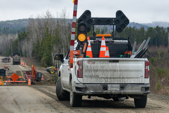 Parents, Quebec, 19 May 2026 : White Chevrolet Silverado pickup truck with traffic control equipment stands on a dirt road at a construction site
