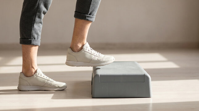 Rehabilitation. Man Stepping on Platform for Mobility Training