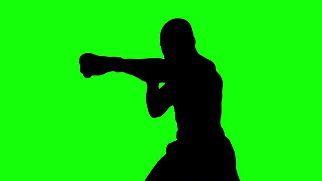 Black silhouette of man boxing on green background. Chroma key green screen for composite and presentation.	