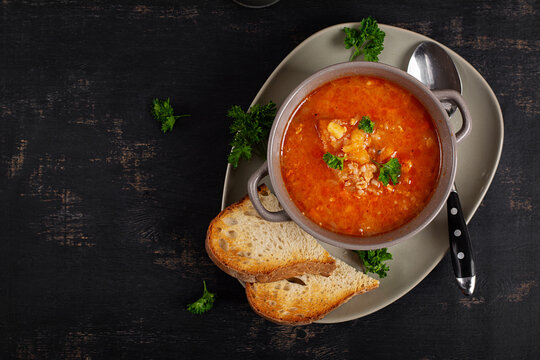 Homemade cabbage soup with minced meat and rustic bread. Czechoslovakian soup. Top view.
