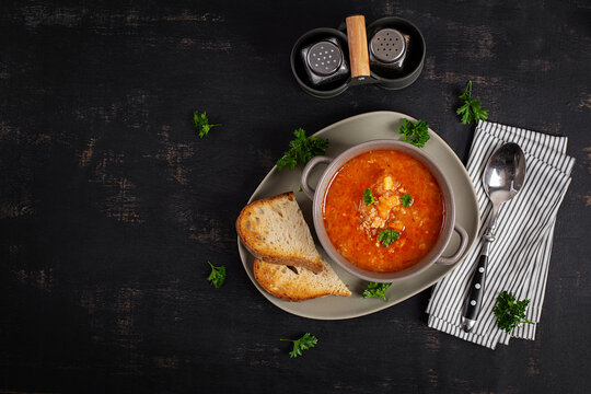 Hearty Cabbage and Ground Meat Soup Served with Sourdough Bread. Czechoslovakian soup. Top view.
