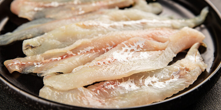 Whiting fish raw fillet fresh seafood  pescetarian diet tasty snack fresh delicious gourmet food background on the table rustic food top view copy space
