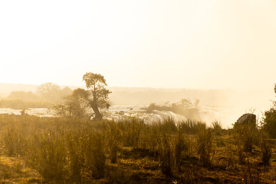 Zambezi River as it tumbles into Victoria Falls at sunrise from the Zambian side, Africa