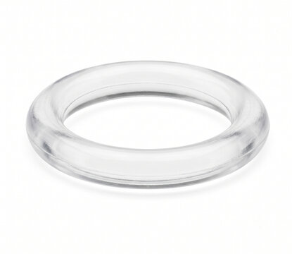 Macro photograph of a clear transparent polyurethane orthodontic elastomeric ligature O-ring.