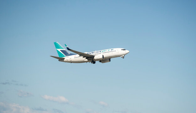 Calgary, Alberta, Canada. July 02, 2023. A WestJet Airlines Boeing 737-700 with identification C-GWSP coming in to land at Calgary International Airport