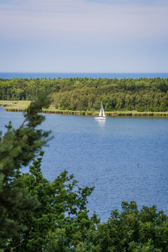 Sunlit Sailing Ship in Navigation Channel near Barh&ouml;ft with Bock Island in Background