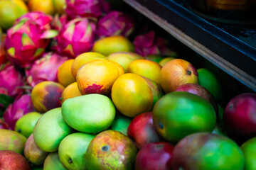 Mixed ripe mangoes at market © ProShine Studio