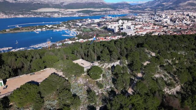 Cinematic drone flight above Marjan Park with panoramic views of Split, the Adriatic Sea, marina and Croatian coastline