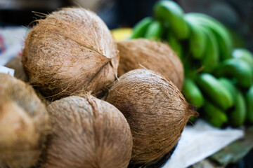Fresh coconuts and green bananas © ProShine Studio