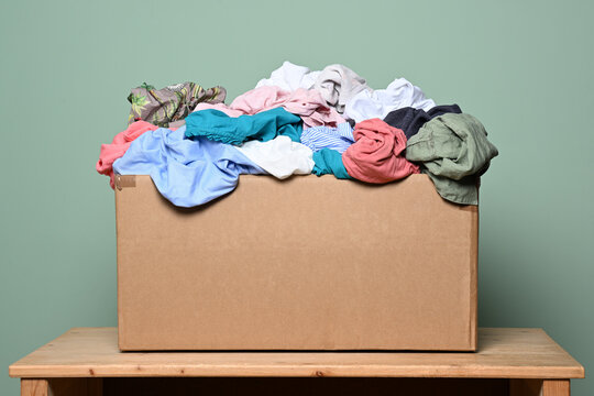 Cardboard box with various clothes