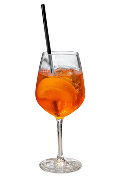 Cold and refreshing Aperol spritz cocktail served in a large wine glass with ice cubes, a fresh orange slice, and a black straw, isolated on white background with clipping path