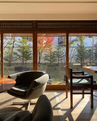 Fototapeta premium Modern cozy lounge with large windows overlooking autumn forest