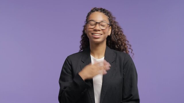Confident college student pointing at herself with a proud smile. Young african woman celebrating personal success, self confidence, achievement and positive attitude