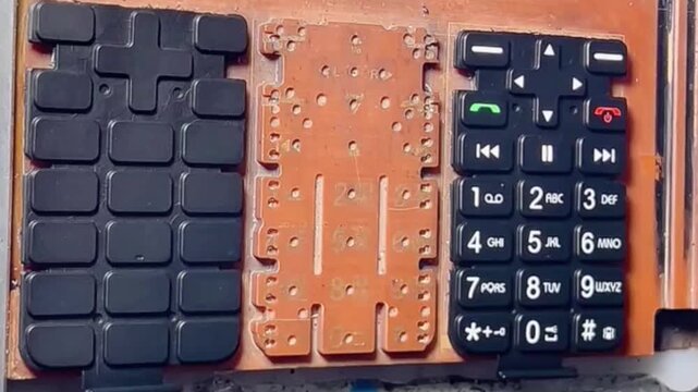 Laser-marking symbols onto mobile phone keypads