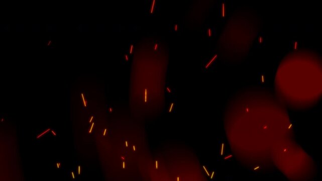 Glowing fire sparks and flying embers rising on dark background. Abstract red bokeh lights glowing with burning hot fiery particles. Magical floating ash particles and bright sparks for film overlays