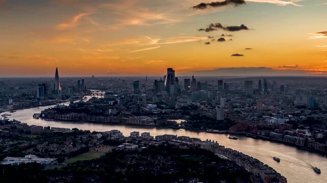 Panoramic summer sunset to dusk time lapse view of the urban skyline of London, England