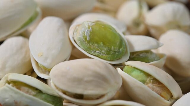 Close-up of roasted pistachios with natural texture and crunchy appearance. Healthy nut snack suitable for food, nutrition, and healthy lifestyle concepts.
