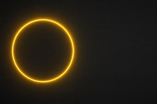 A minimalist image featuring a perfectly centered, glowing yellow circle against a dark background, creating a striking visual element with a sense of balance and symmetry.