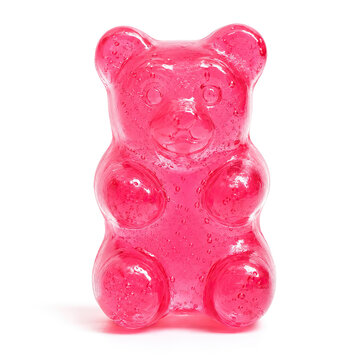 A glossy pink gummy bear with a translucent appearance, featuring a classic rounded body and four arms.